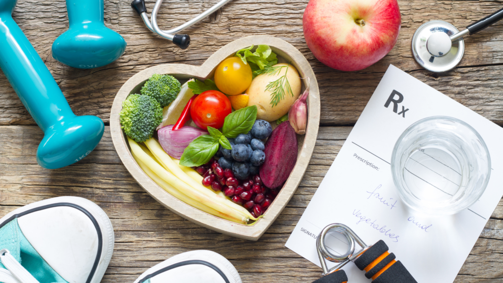 Healthy food in heart shape and exercise equipment