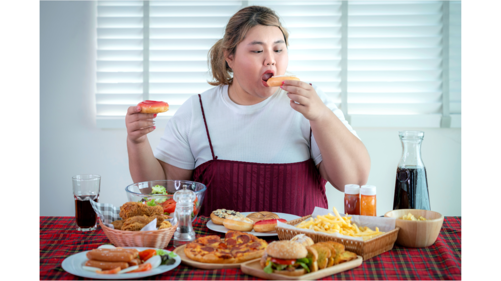 Young woman eats fat food 