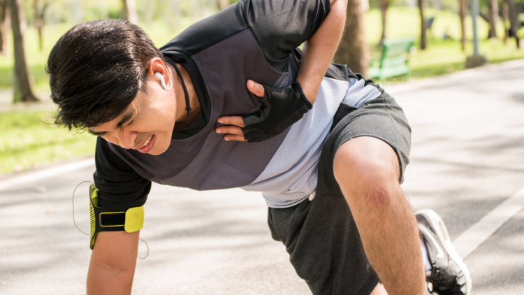 Young man hold heart while running having attack